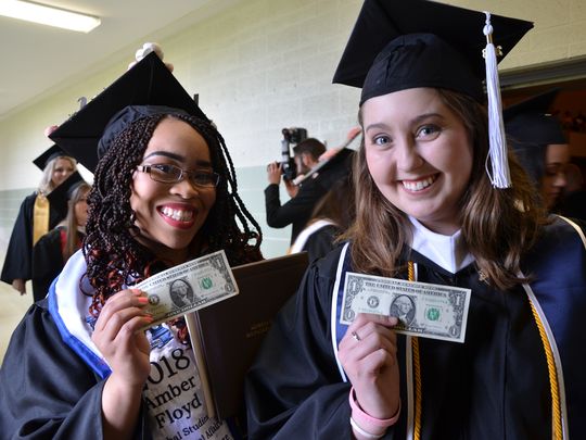 Alverno grads cash in with fresh one dollar bills from U.S. treasurer at graduation ceremony